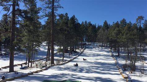 Flagstaff snow park - Dec 28, 2023. Bryson Herbert, 10, tubes down the hill with sister Alivia Herbert, 7, at the Flagstaff Snow Park at Fort Tuthill County Park on Thursday. Hattie Loper, Arizona Daily Sun.